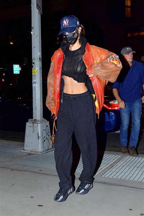 Bella Hadid Flaunts Her Taut Midriff In A Semi Sheer Black Crop Top As She Steps Out In