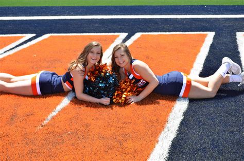 cheerleading twins pose college senior photo twins posing cheerleading girly games