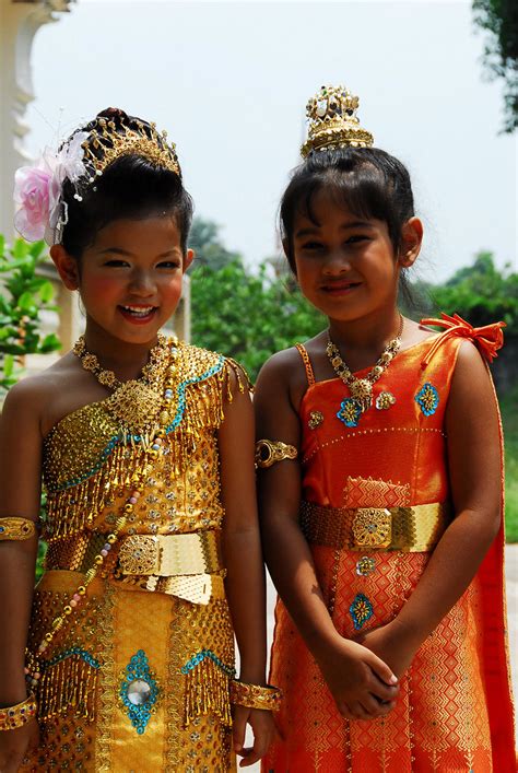 The skirt is made from a long cloth with folding on one side. Two happy Thai children in traditional costume | A school ...