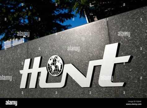 A logo sign outside of the headquarters of the Hunt Oil Company in