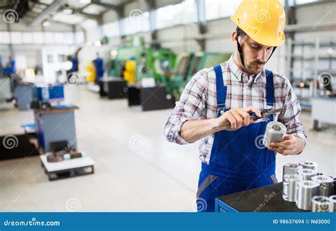 Male Worker And Quality Control Inspection In Factory Stock Photo