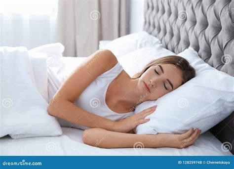 Beautiful Teen Girl Sleeping With Comfortable Pillow In Bed Stock Photo