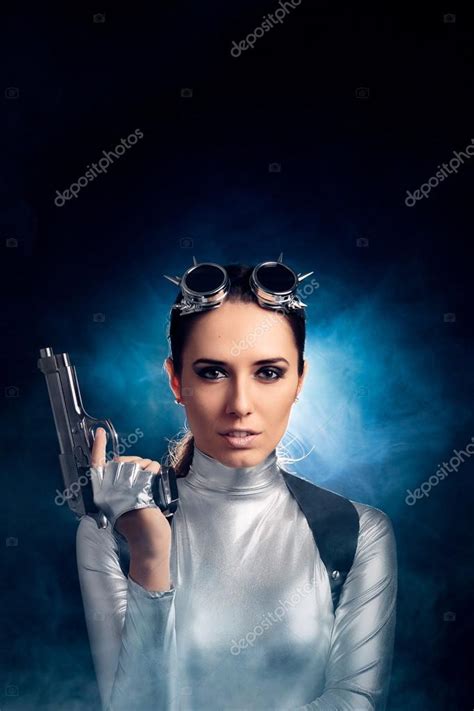 Woman In Silver Space Costume Holding Pistol Gun Stock Photo By