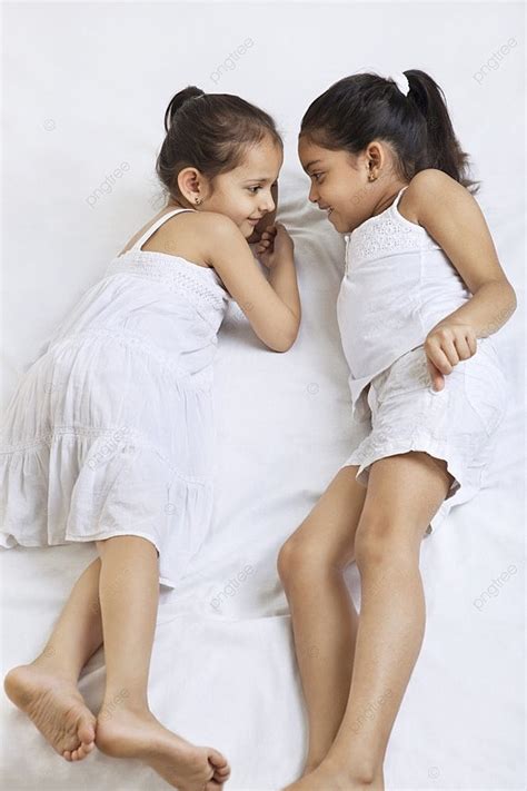 Sisters Lying On Bed Photo Background And Picture For Free Download Pngtree