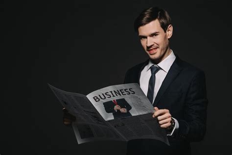 Premium Photo Smiling Businessman Reading Business Newspaper Isolated