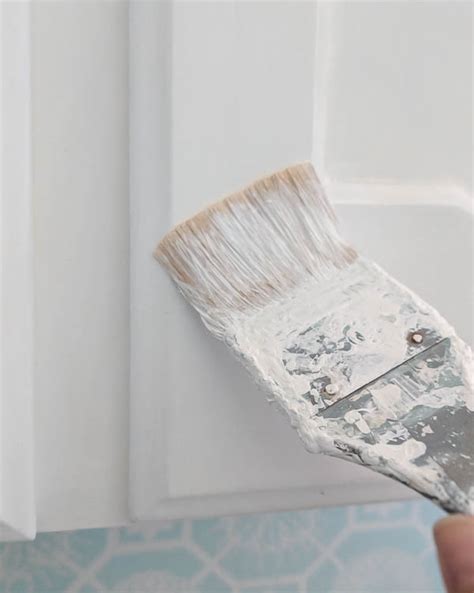 Touch up paint is something we don't always think about when we refinish furniture. How to Touch Up Chipped Cabinet Paint - Lovely Etc.