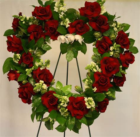 We are known for our design of unique gifts and baskets for sympathy, cancer, breast cancer, get well and divorce, for women, men and children. Heart shaped standing spray of red roses, white snap ...