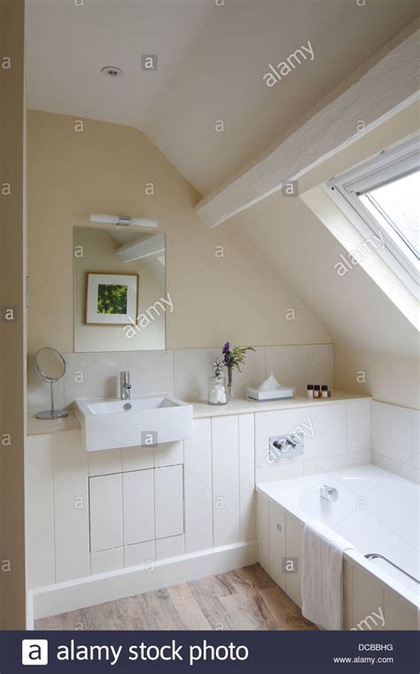 Tiling bathroom ceilings, one most overlooked aspects tiling ceiling wet environment such bathroom shower should sloped crowned … Pale bathroom with sloping ceiling and skylight, Barnsley ...