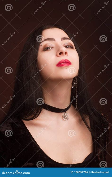 Brunette On Dark Background Dressed In Goth Style Stock Photo Image