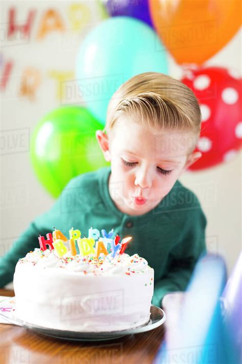 Boy 2 3 Blowing Out Candles Stock Photo Dissolve