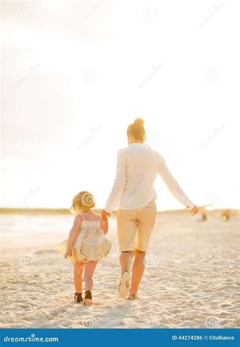 Mother And Baby Girl Walking On The Beach Stock Photo Image Of