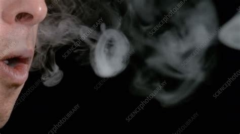 Person Blowing Smoke Rings Slow Motion Stock Video Clip K0070864