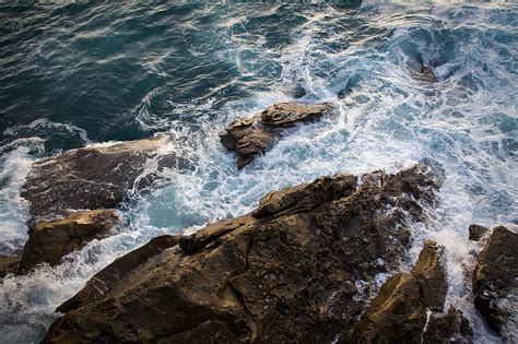 Brown Rock Formation Beside Blue Sea During Daytime Hd Wallpaper Peakpx