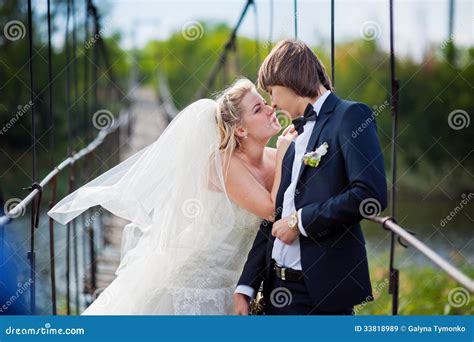 Bride And Groom Standing On A Bridge Stock Image Image Of Girl