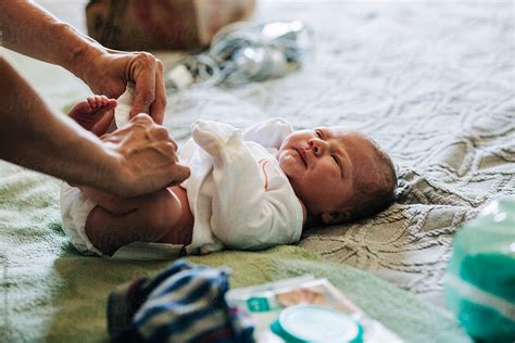 A Newborn Baby Getting A Diaper Change By Stocksy Contributor Amy
