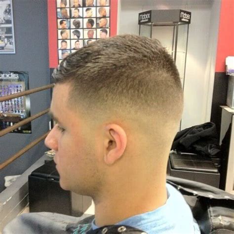The cut involves trimming the hair to at least two inches but ensuring that the front part of the head has extra length that can be brushed as part of styling. military-haircuts-for-men-03 - Mens Hairstyle Guide