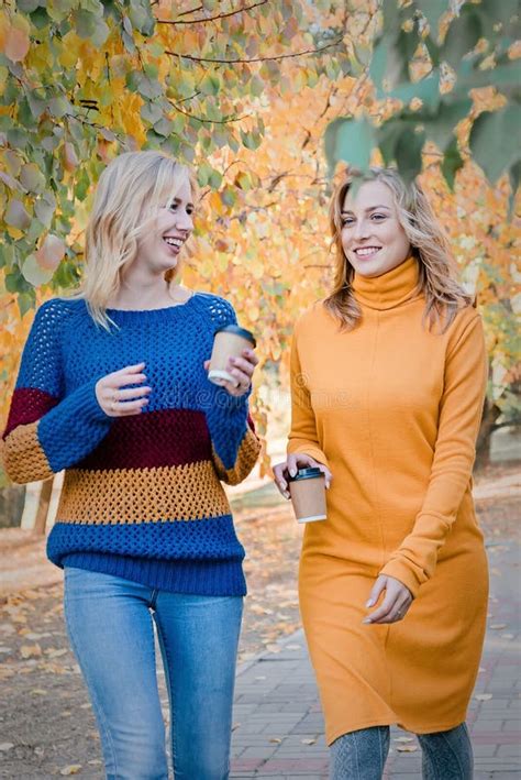 Cheerful Attractive Two Young Women Best Friends Walking And Having Fun