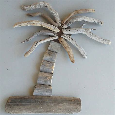 A Piece Of Driftwood That Has Been Placed On The Wall With A Palm Tree