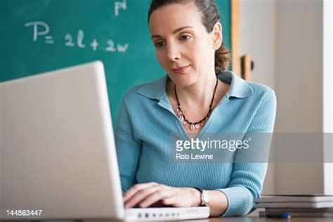 Usa California Los Angeles Happy Female Teacher Using Laptop In
