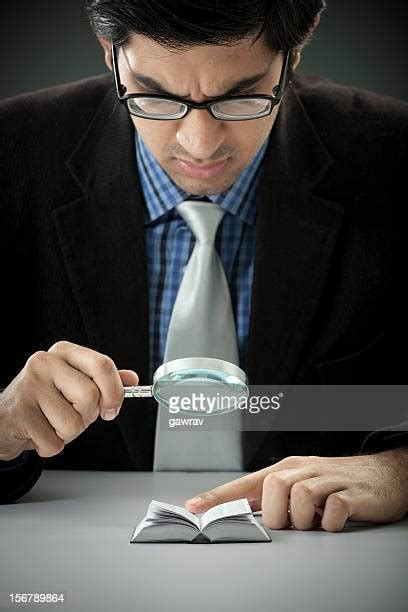 Man Looking Through Magnifying Glass Photos And Premium High Res