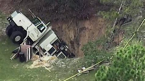 Florida Sinkhole Swallows Truck Bbc News