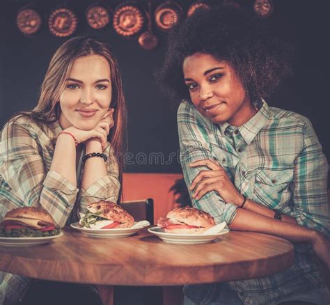 Multiracial Friends Eating In A Cafe Stock Photo Image Of Food