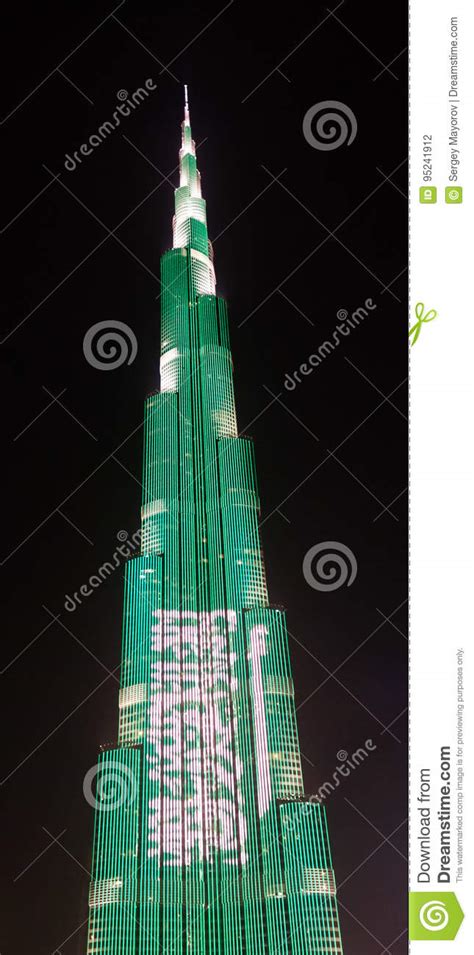Night View To Burj Khalifa Skyscraper In Dubai Flag Of Saudi Arabia