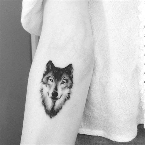 Small Black And Grey Style Wolf On The Forearm Small Tattoos For