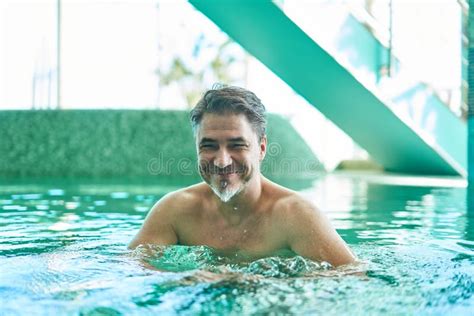 Happy Smiling Older Man Enjoying Indoor Swimming Pool Concepts Of Spa Wellness Stock Image
