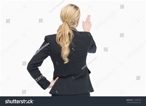Business Woman Pointing Out Something From Behind Stock Photo 119350195