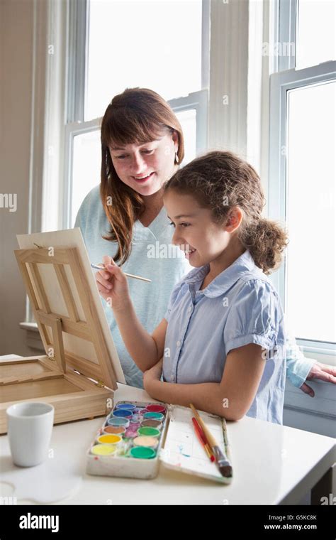 Mother And Daughter Painting Stock Photo Alamy