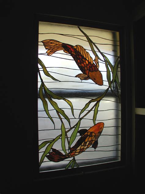Made using sections of glass held together with leading, designs vary from a simple border or coloured insets to decorative period patterns. Koi Fish Stained Glass bathroom Privacy Window