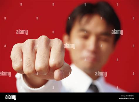 A Man Punching In Front Of A Camera Stock Photo Alamy