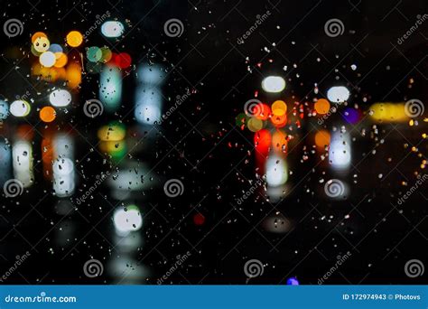 Rain Drops On Window With Road Light Bokeh City In Night Stock Image