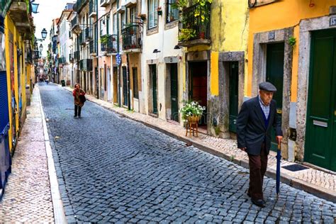 Lisbon Portugal 05 06 2016 People Walking On A Narrow Street