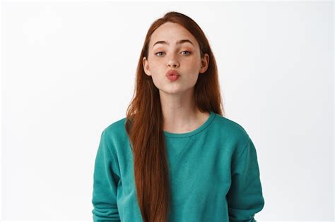 Free Photo Beautiful Caucasian Redhead Girl Kissing Pucker Lips And