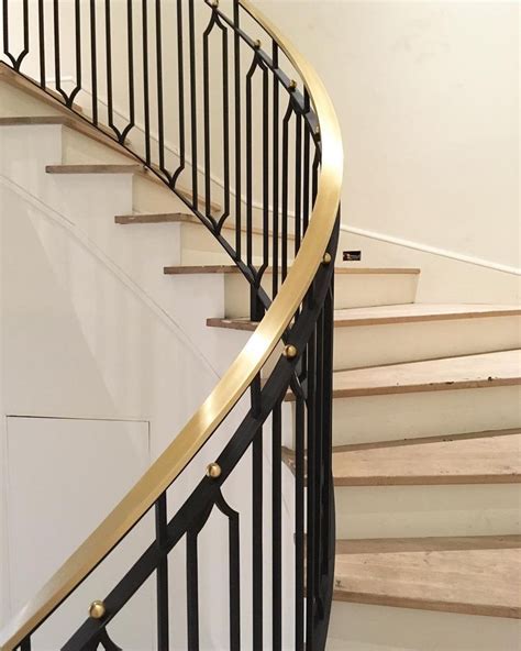 Wood is quite possibly the most flexible of all materials used to bring your stair railing ideas to life. design by jenkins interiors | curved brass and iron ...