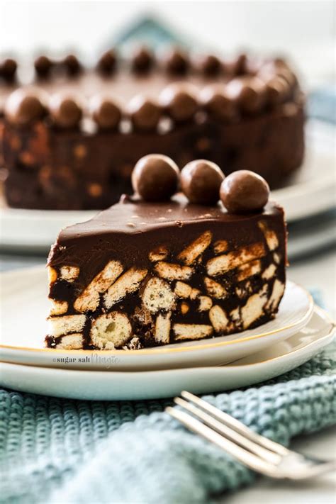 Chocolate, cookies and maltesers all mixed up and set so that you can slice it like a cake, this one's a no bake dream. No Bake Chocolate Fridge Cake | Sugar Salt Magic
