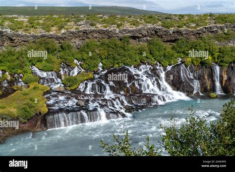 Small Waterfall In Iceland Hraunfossar On A Sunny Day During Summer