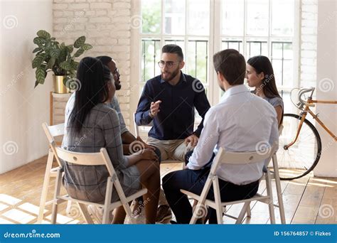 Male Psychologist Therapist Speak At Group Therapy Session Helping Patients Stock Image Image