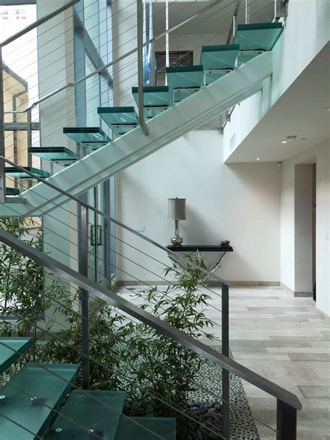 Aside from the visual appeal, installing glass railings will actually add more value to your property. Super clean contemporary glass and steel stairs | Glass ...