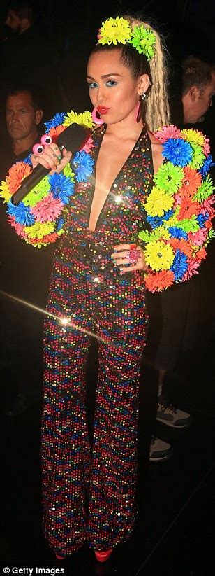 mtv vmas hostess miley cyrus causes a stir with 11 eyebrow raising outfits daily mail online