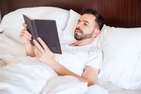 Man Reading A Book On His Bed Stock Image Image Of Background Adult
