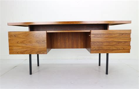 Investing in a proper work desk is an obvious place to start, but you want to make sure it'll look good in your home, too — especially if you don't have space for a totally separate home. Mid-Century Modern Rosewood Writing Desk by Leo Bub for ...