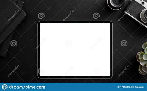 Top View Of Photographer Workplace With Blank Screen Tablet Camera