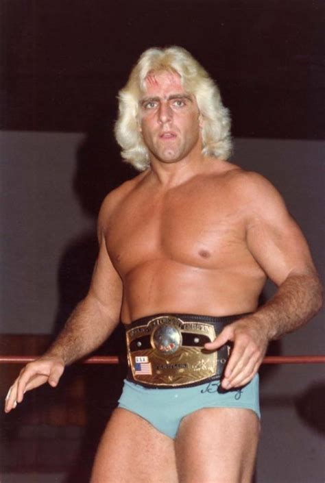 A Man With Blonde Hair Wearing A Wrestling Belt