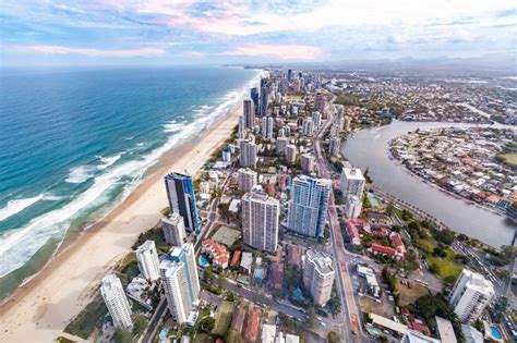 The city of gold beach sits just south of the rogue river, about forty miles north of the california state line. Aerial view of Gold Coast city skyline and ocean beach ...