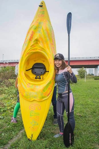 Japanese Artist Megumi Igarashi Known As Rokudenashiko Poses With Her Kayak Modeled On Her
