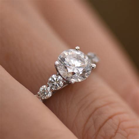 Round Brilliant Cut Diamond Engagement Ring With Graduated Diamond