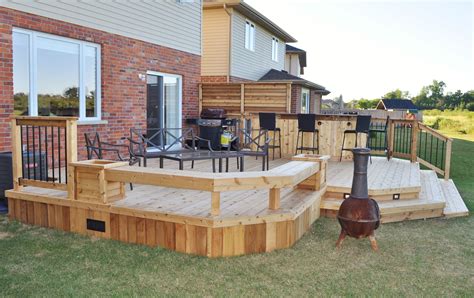 You'll find many beautiful deck railing ideas using cable railing. deck bars | Cedar Deck & Bar 2 | outdoor ideas | Pinterest | Cedar deck, Decking and Bar